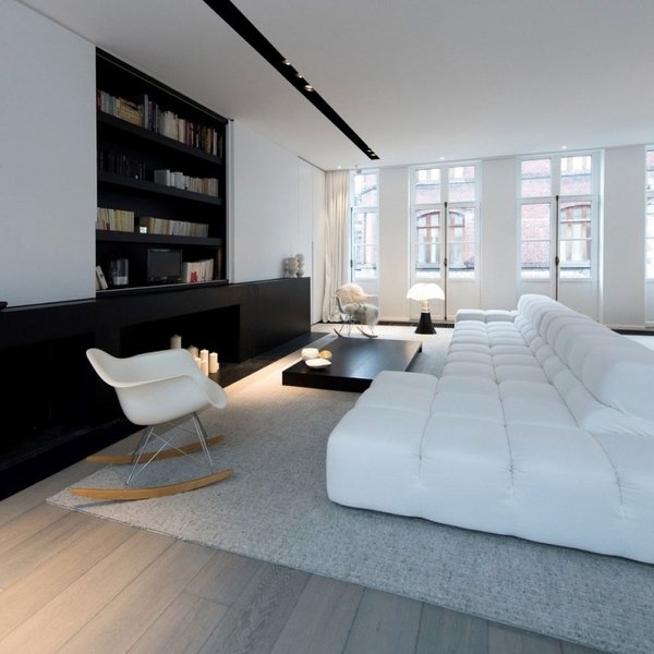 black-and-white-living-room-interior-design-modular-couch-gray-carpet-black-fireplace