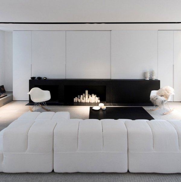 minimalists-living-room-design-black-and-white-interior-white-modular-couch-modern-fireplace